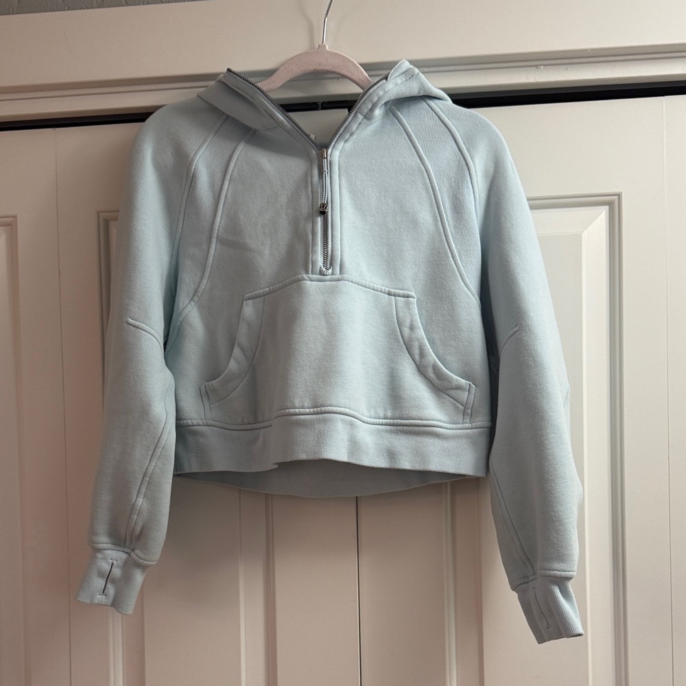 Lululemon Women's Light Blue cropped scuba hoodie.